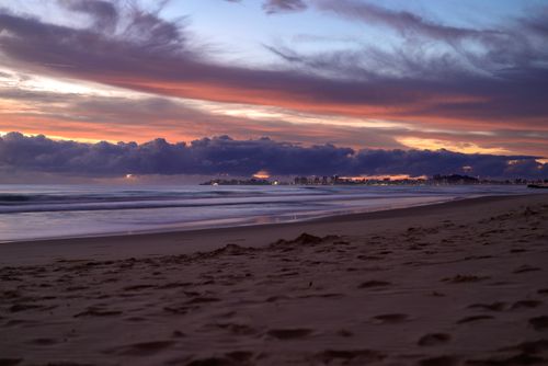 Free Breathtaking sunset over Currumbin Beach, Australia featuring vibrant skies and calm waves. Stock Photo