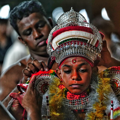 Free Intricate traditional ritual costume adornment in an intense cultural ceremony setting. Stock Photo