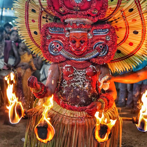 A woman in a costume with fire and flames