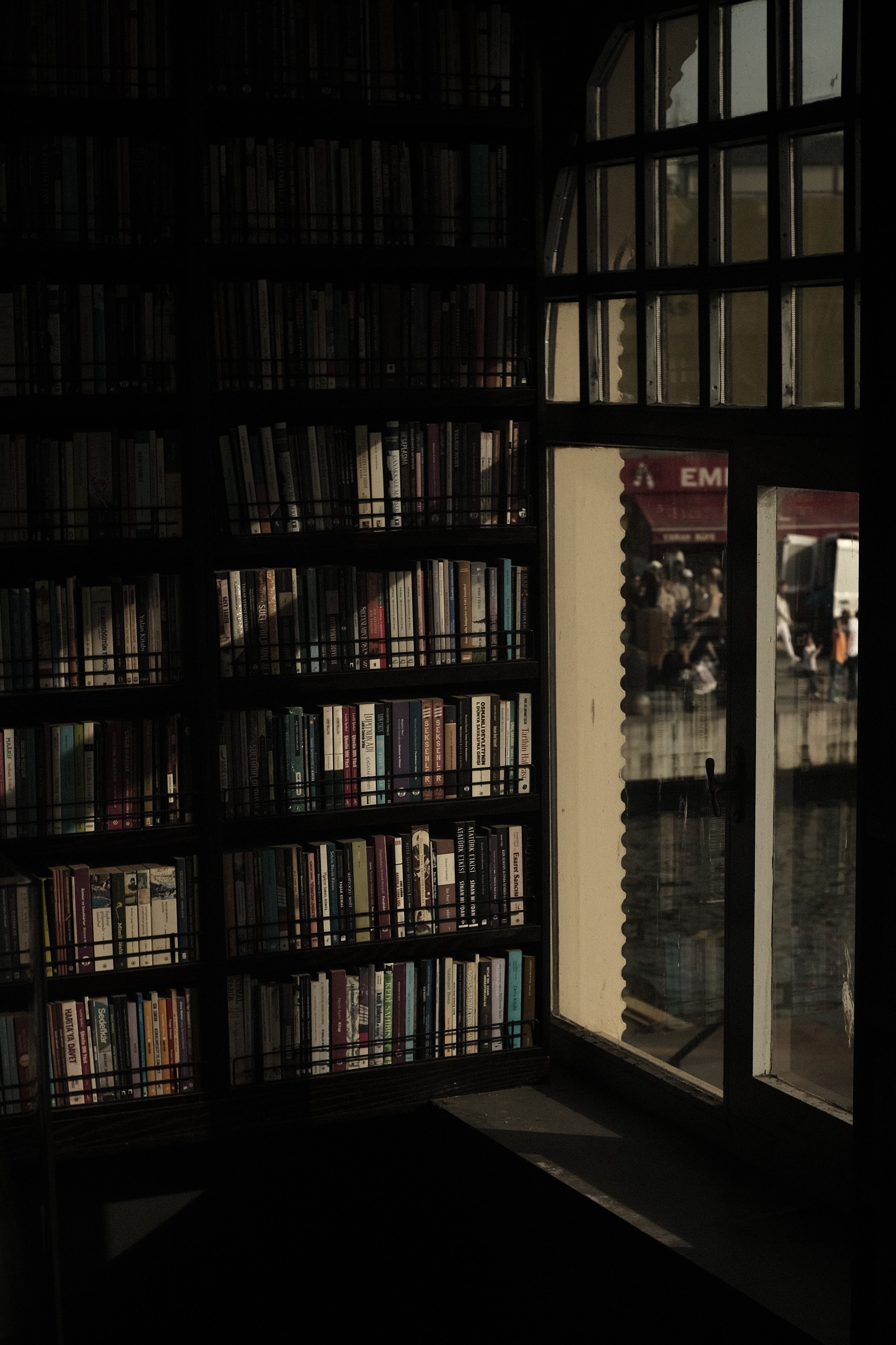 Books on Shelves by Window · Free Stock Photo