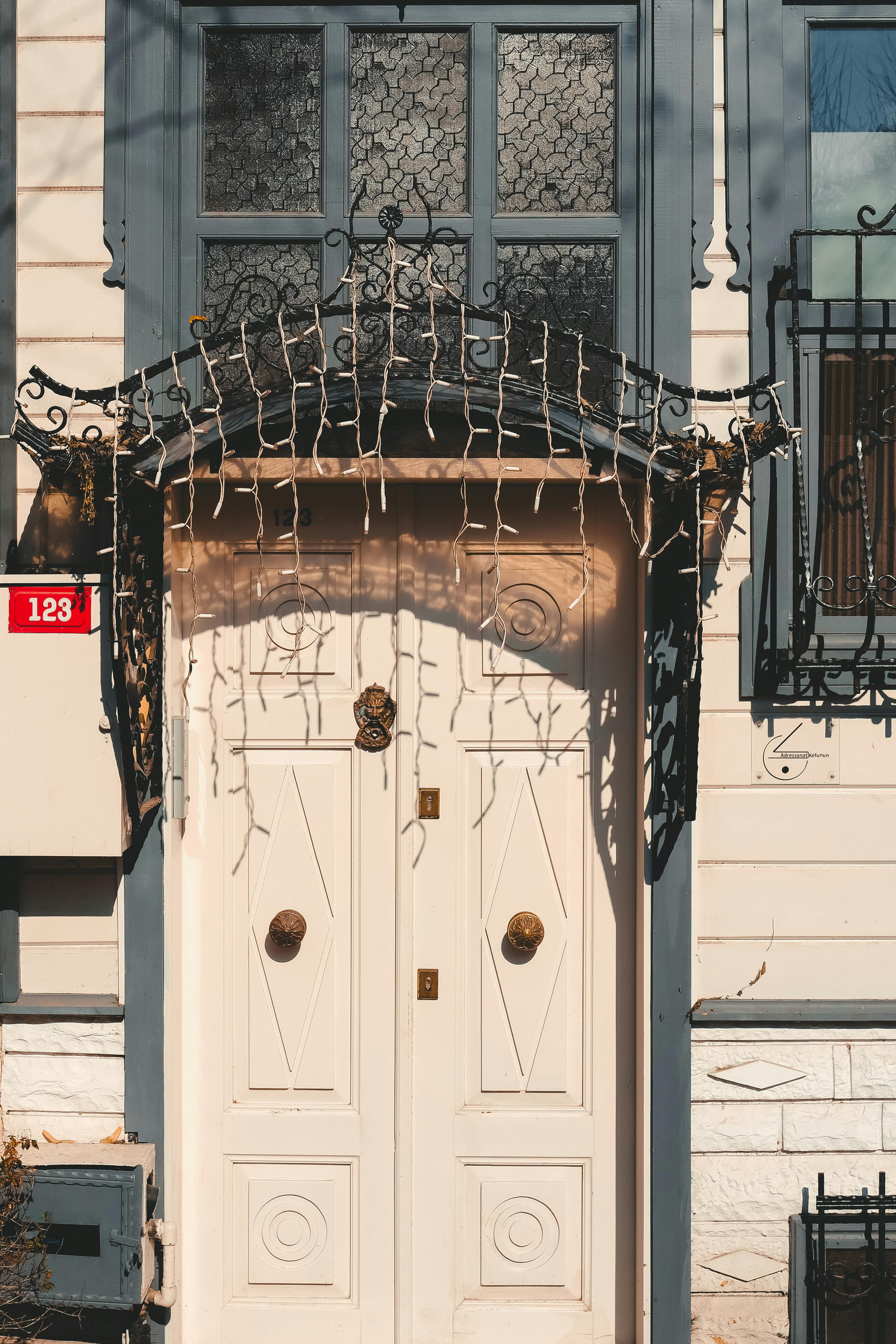 Charming white and blue doorway with ornate ironwork in Istanbul, Türkiye.