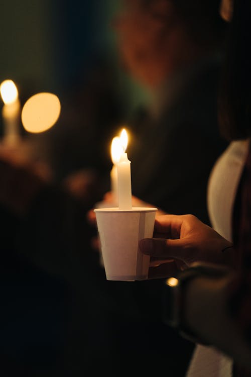 Candles are lit during a vigil for the victims of the mass shooting at the marjory stoneman davis high school in parkland, florida, on february 17, 2018