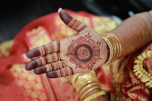 A woman's hands with henna on them