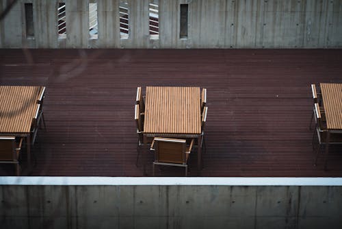 A table and chairs on a wooden deck