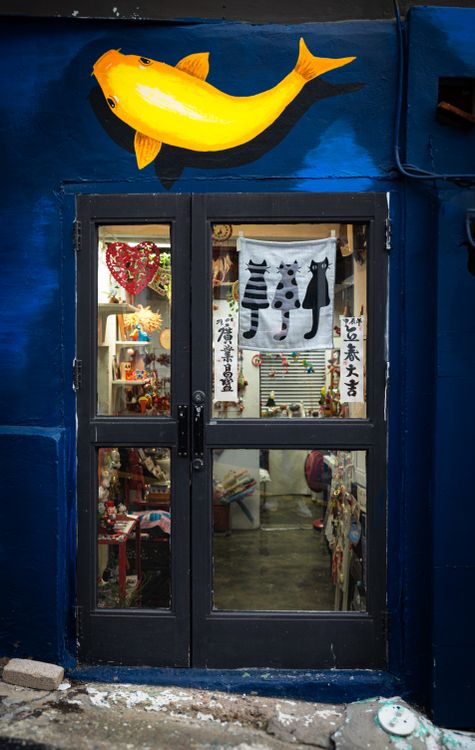 Fish over Door to a Store · Free Stock Photo