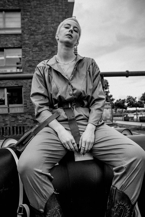 Free Monochrome portrait of a woman in Berlin, showcasing urban style and attitude. Stock Photo