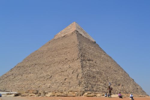 Free A captivating view of the Great Pyramid of Giza in Egypt beneath a clear blue sky, an iconic ancient wonder. Stock Photo