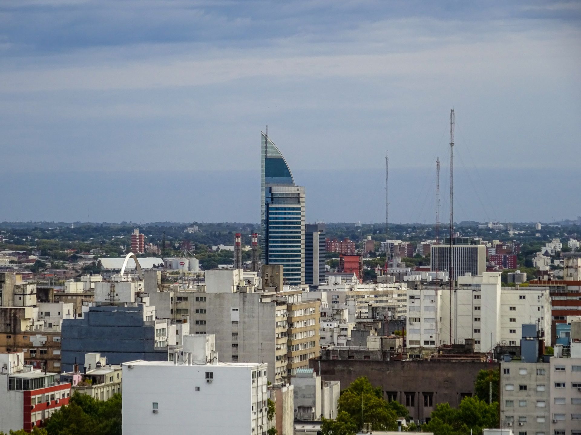 Aerial view of Montevideo's urban landscape featuring a prominent telecommunications tower.