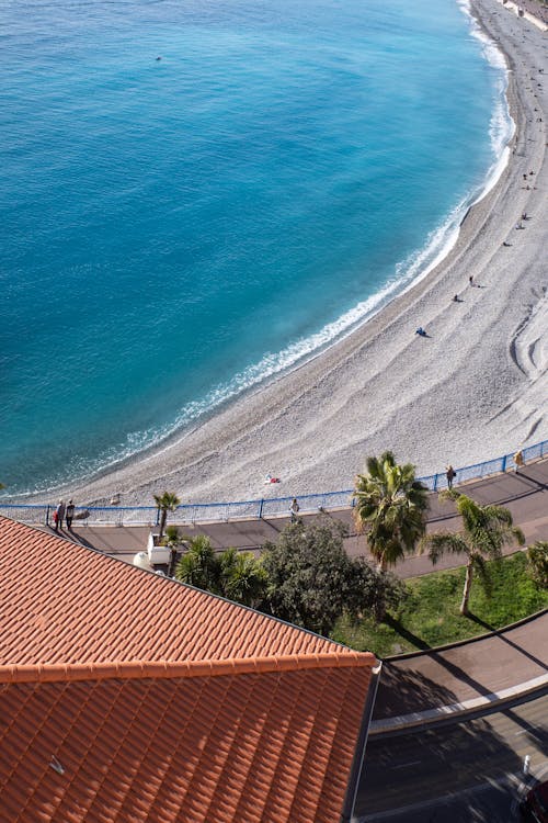 A view of the beach and ocean from a balcony