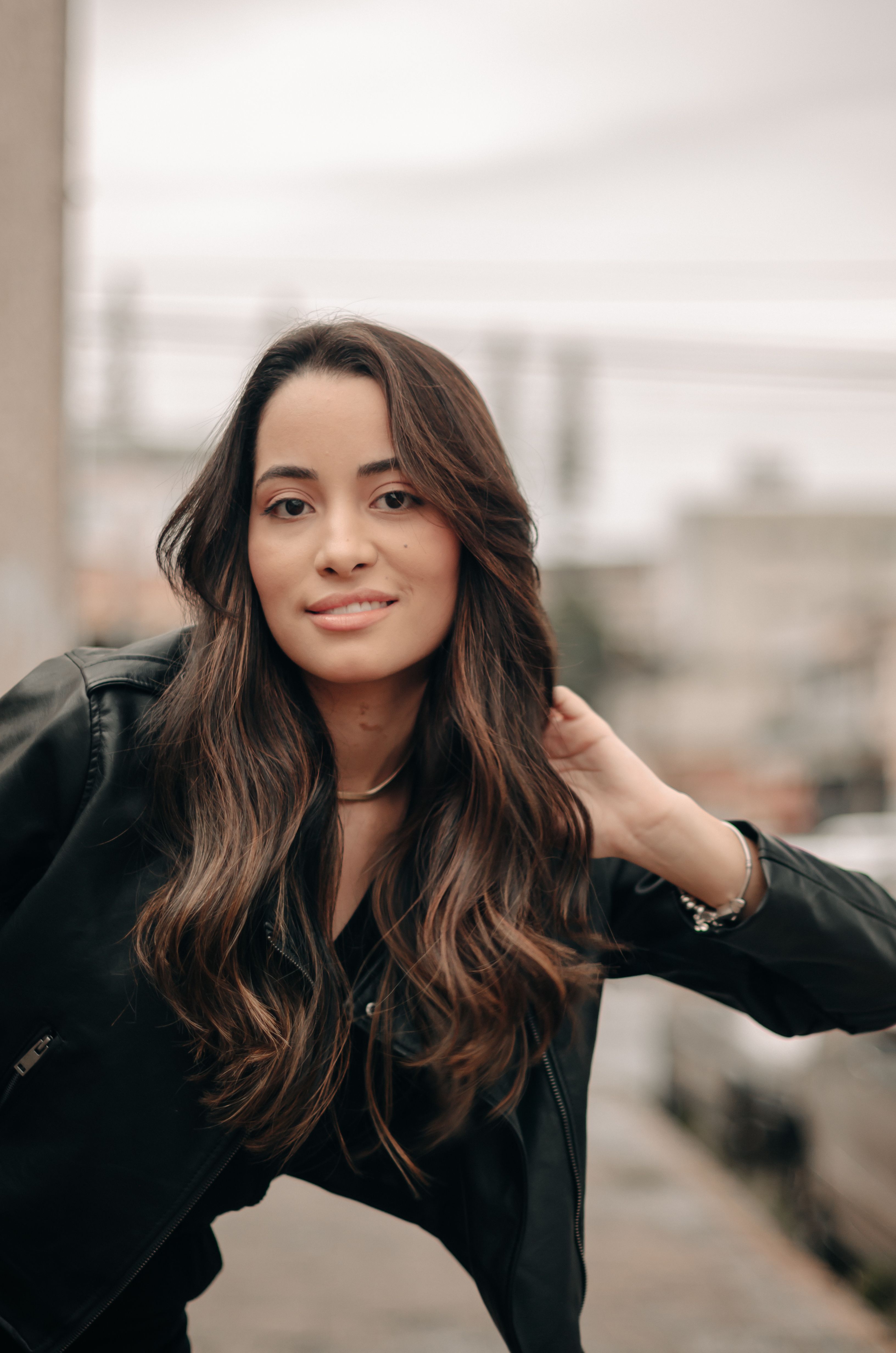 Young Woman in a Leather Jacket Posing Outside · Free Stock Photo