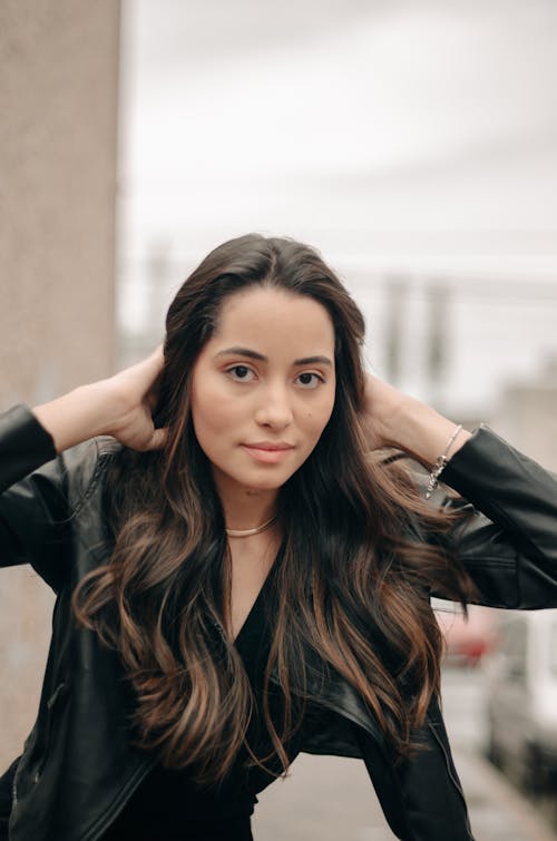 Free Portrait of Brunette Woman Wearing Leather Jacket  Stock Photo