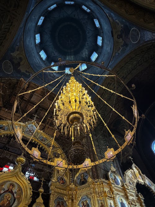 A chandelier hanging from the ceiling of a church