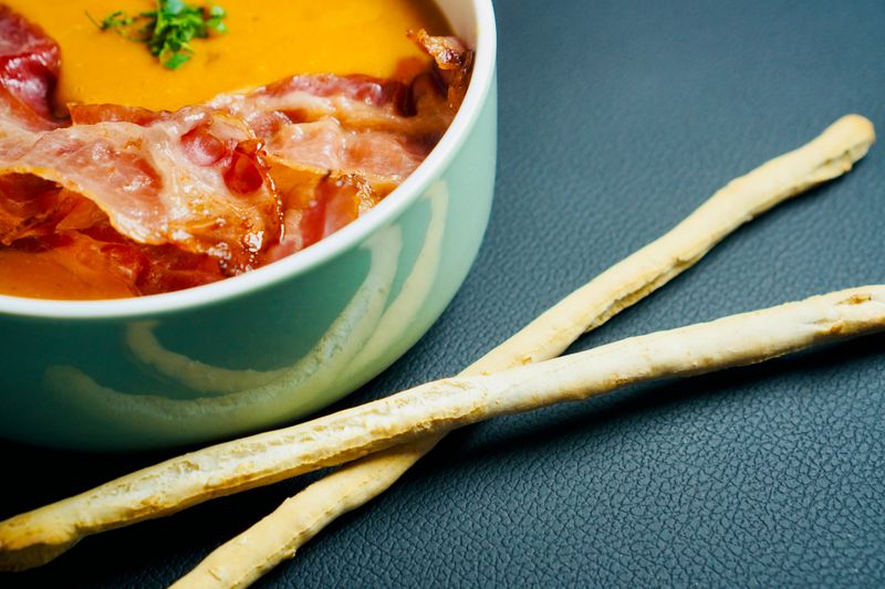 baked potato soup topped with bacon and chives