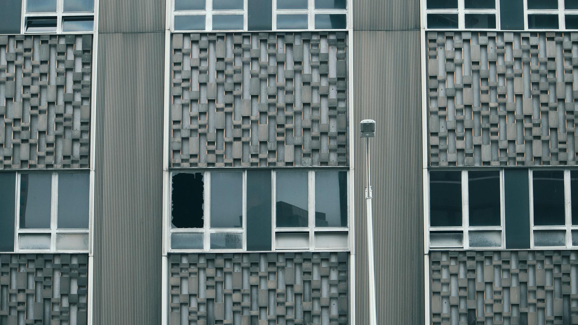 Facade of an Office Building with a Broken Window