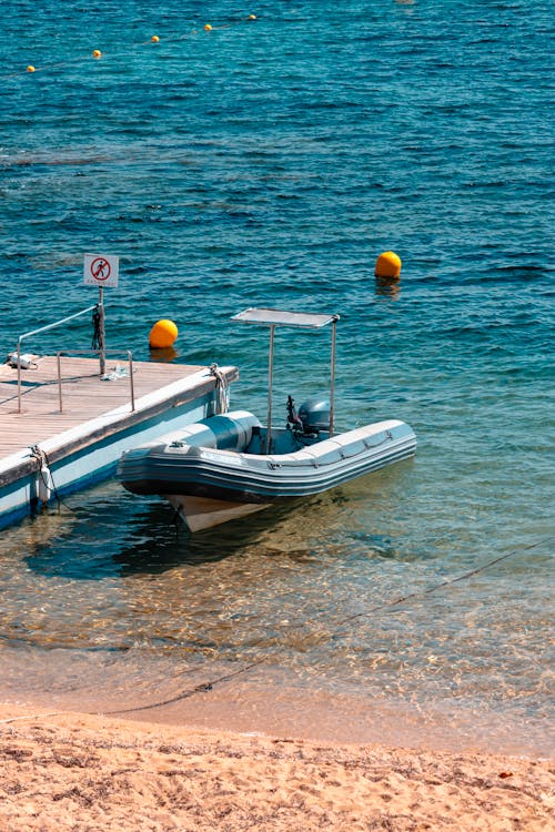 A boat is parked at the edge of the water