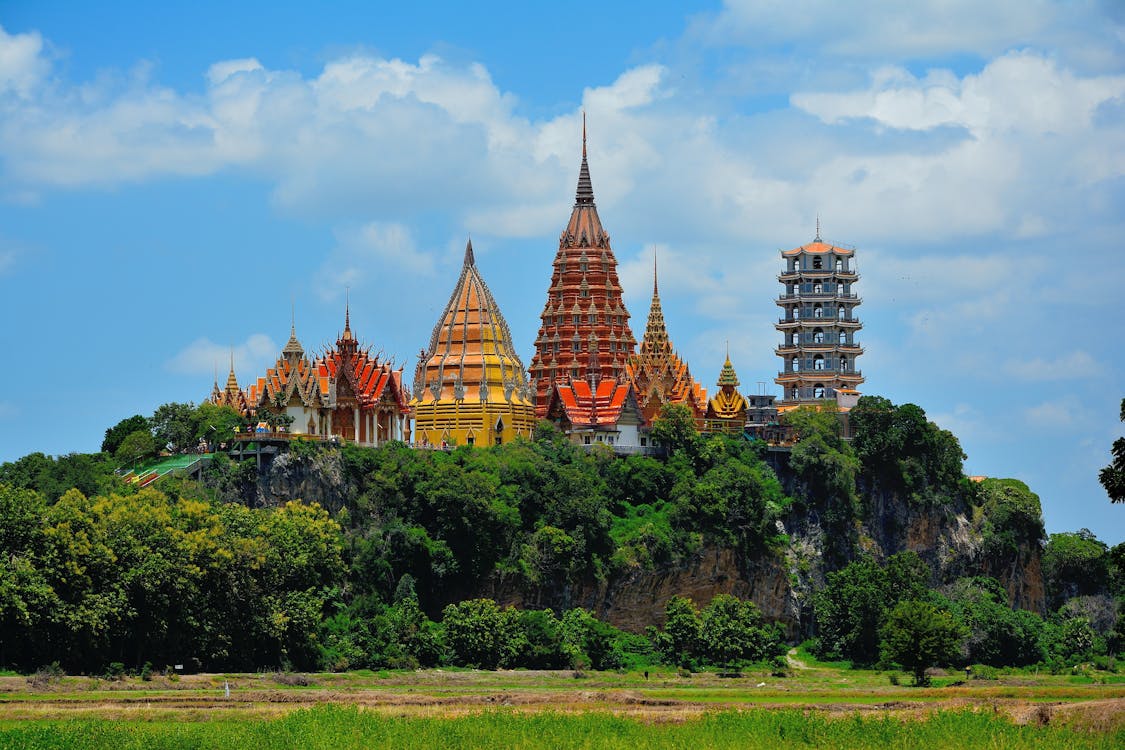 Free Blue and Beige Pagoda Tower Beside Forest Stock Photo