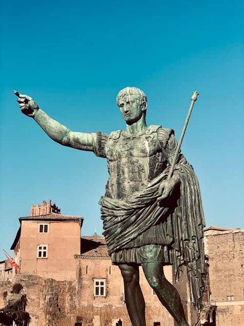 A statue of a roman emperor with a spear