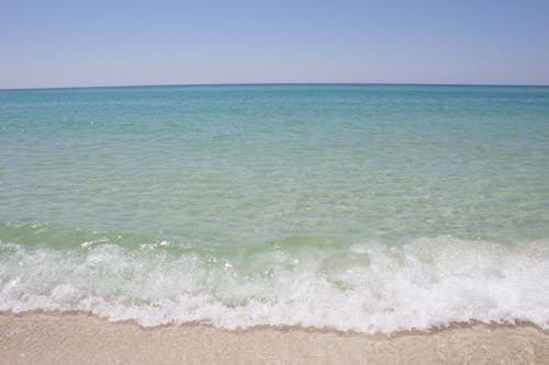 Gratis stockfoto met blauw water, brekende golven, strand