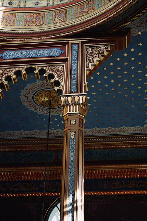 The ceiling of the mosque is decorated with blue and gold