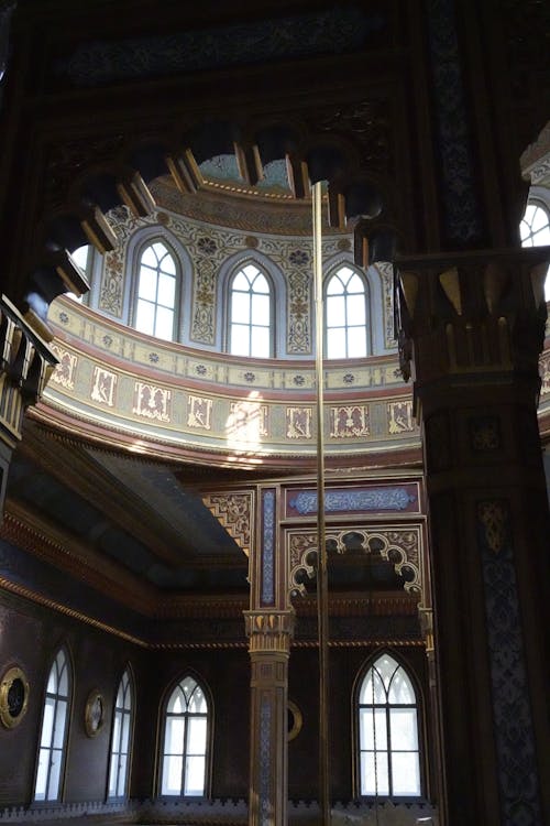 The interior of a building with ornate ceiling