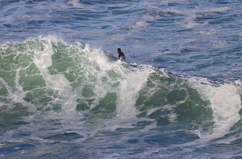 A surfer riding a wave in the ocean