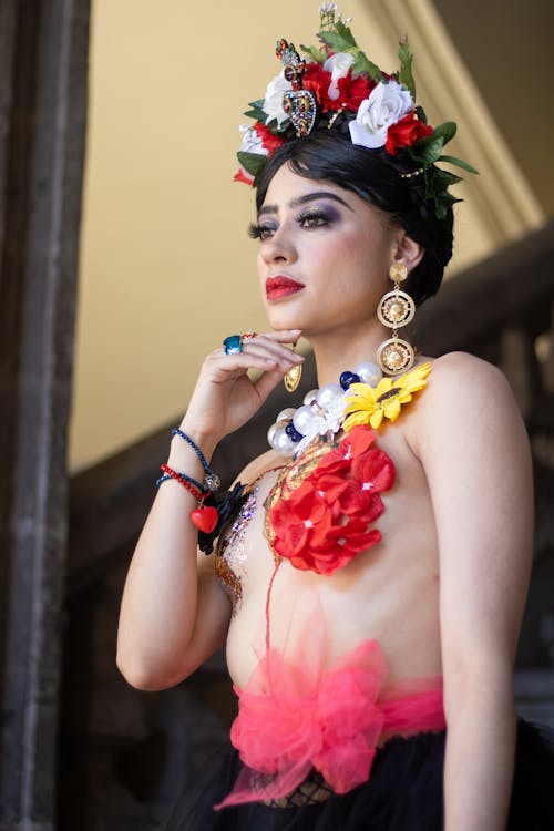 A Young Person Posing in a Costume with Flowers and a Flower Crown