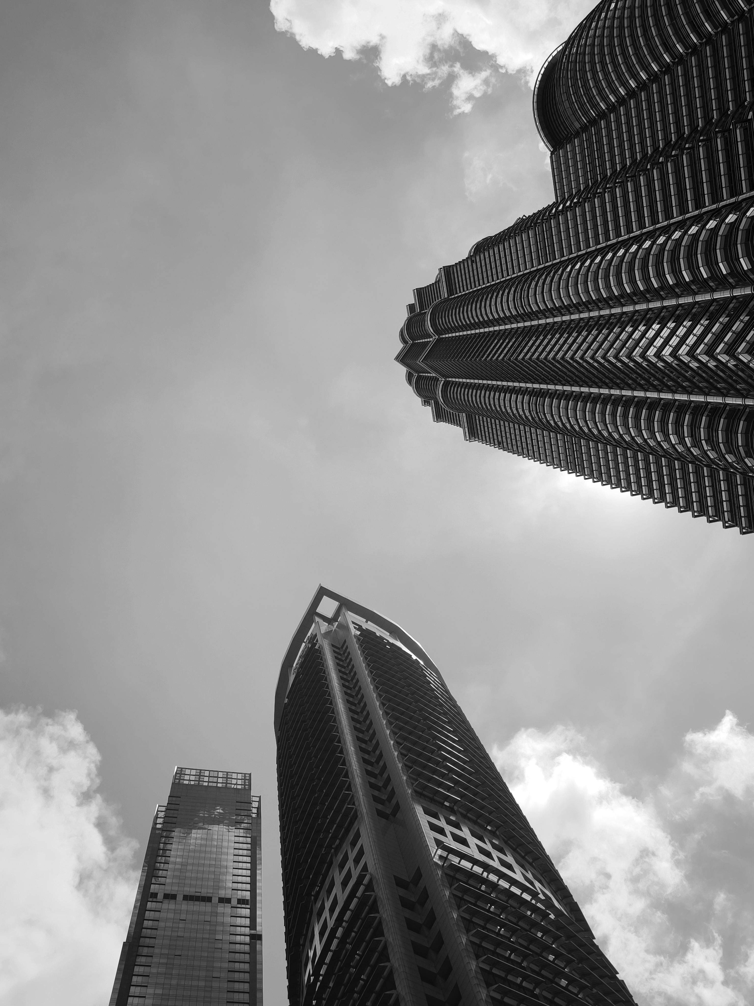 Black and white photo of tall buildings in the sky · Free Stock Photo
