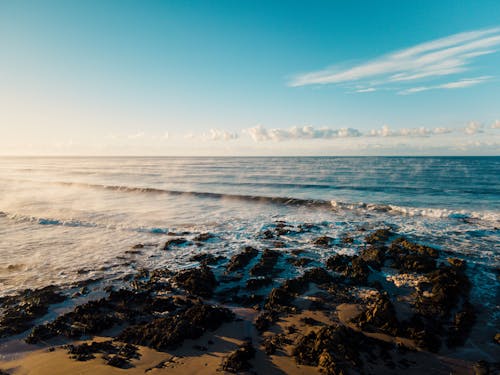 Gratis stockfoto met atlantische oceaan, brekende golven, dageraad