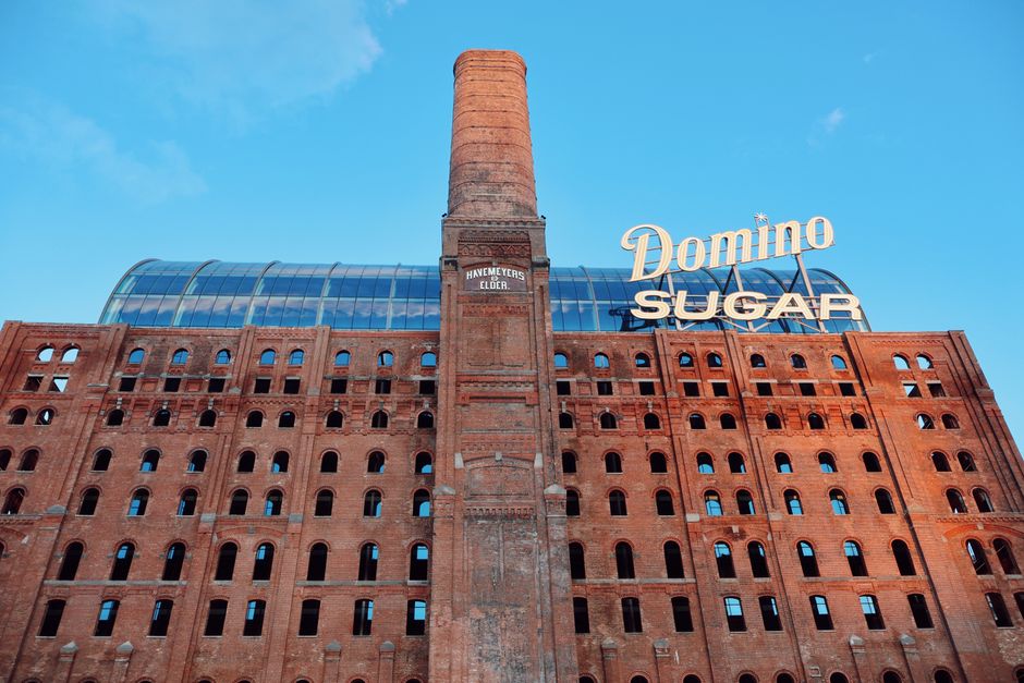 The Domino Sugar Factory in Williamsburg, a symbol of NYC's tech hub evolution - nyc async vibe jobs The Domino Sugar Factory in Williamsburg, a symbol of NYC's tech hub evolution - nyc async vibe jobs