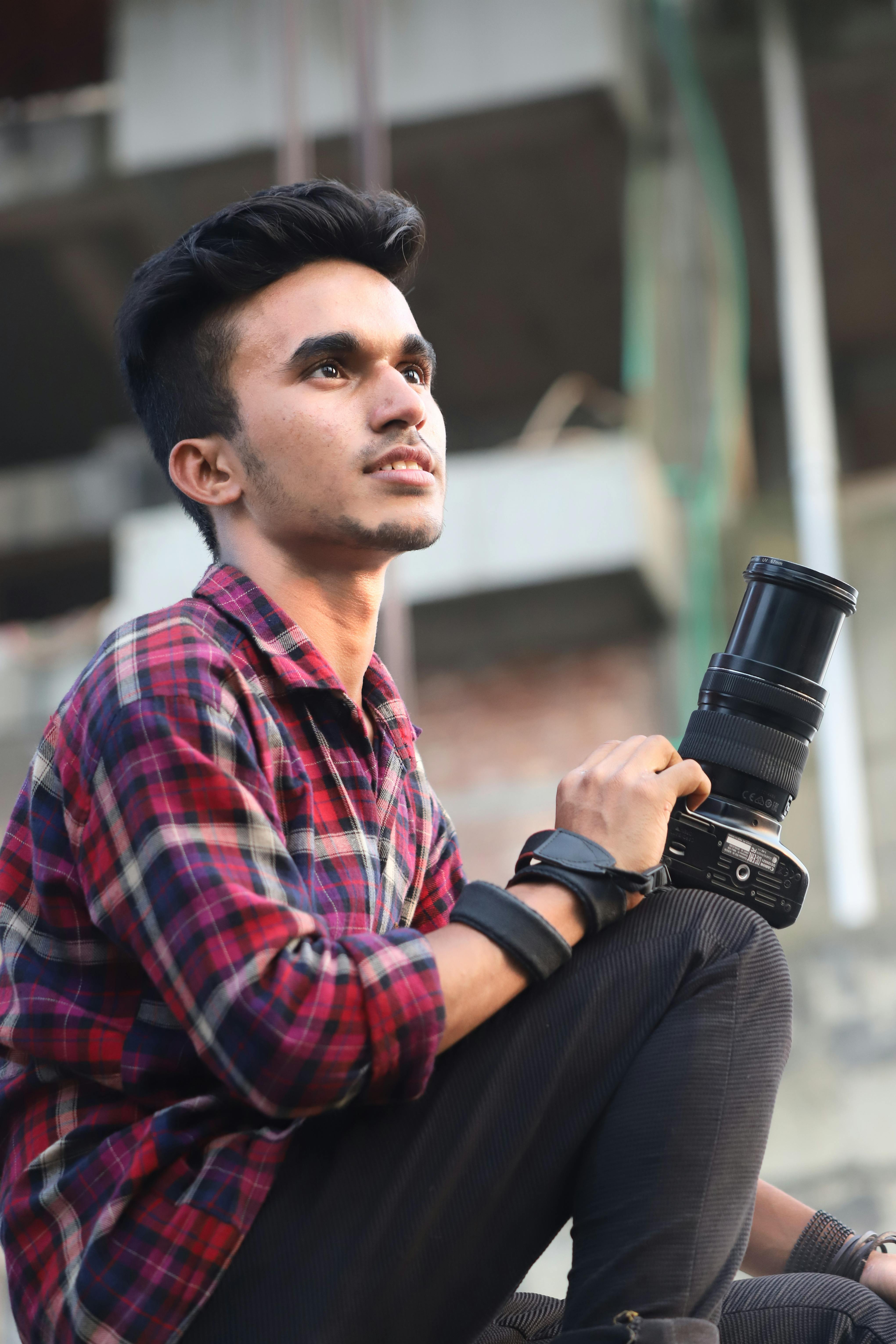 Photographer with camera. Front pose Stock Photo - Alamy