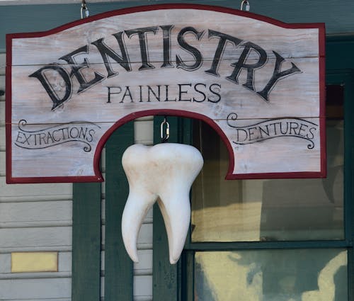 Free Dentistry Painless Signage Stock Photo