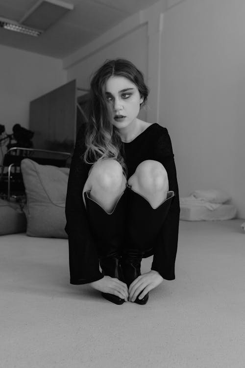 Squatting Woman in Black and White
