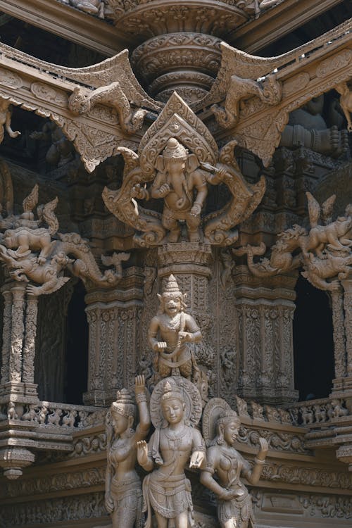 A sculpture of a temple with statues on it
