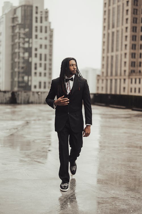 A Man Wearing a Suit in a City 