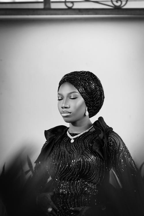 Portrait of Woman in Dress and Hat in Black and White