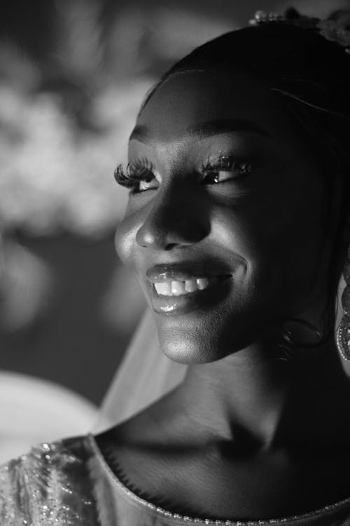 Black and white photo of bride smiling