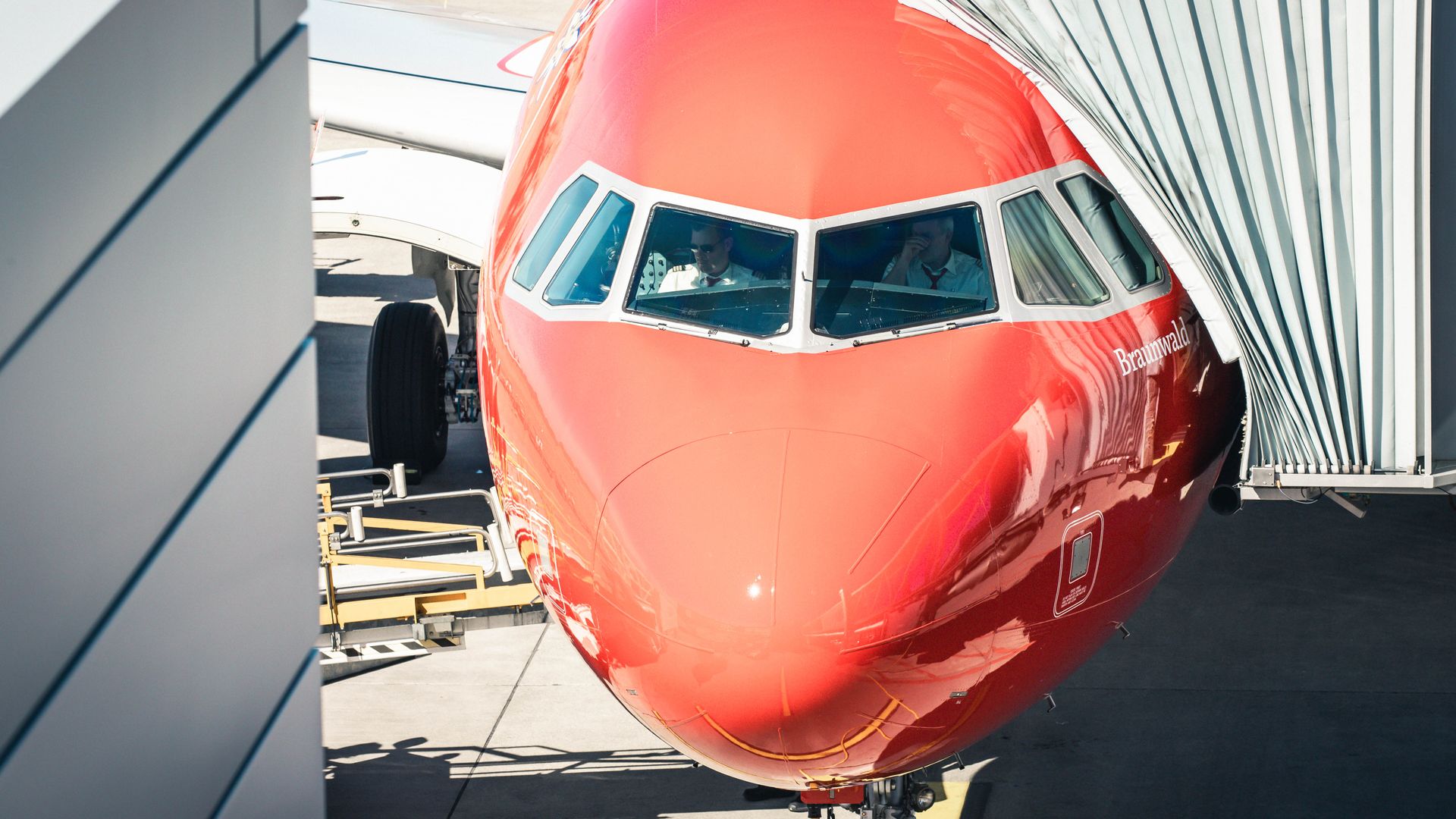 Modafinil for Pilots: Unlocking Peak Performance Front view of an Airbus A320-200 docking at Zurich Airport with pilots inside the cockpit — modafinil for pilots