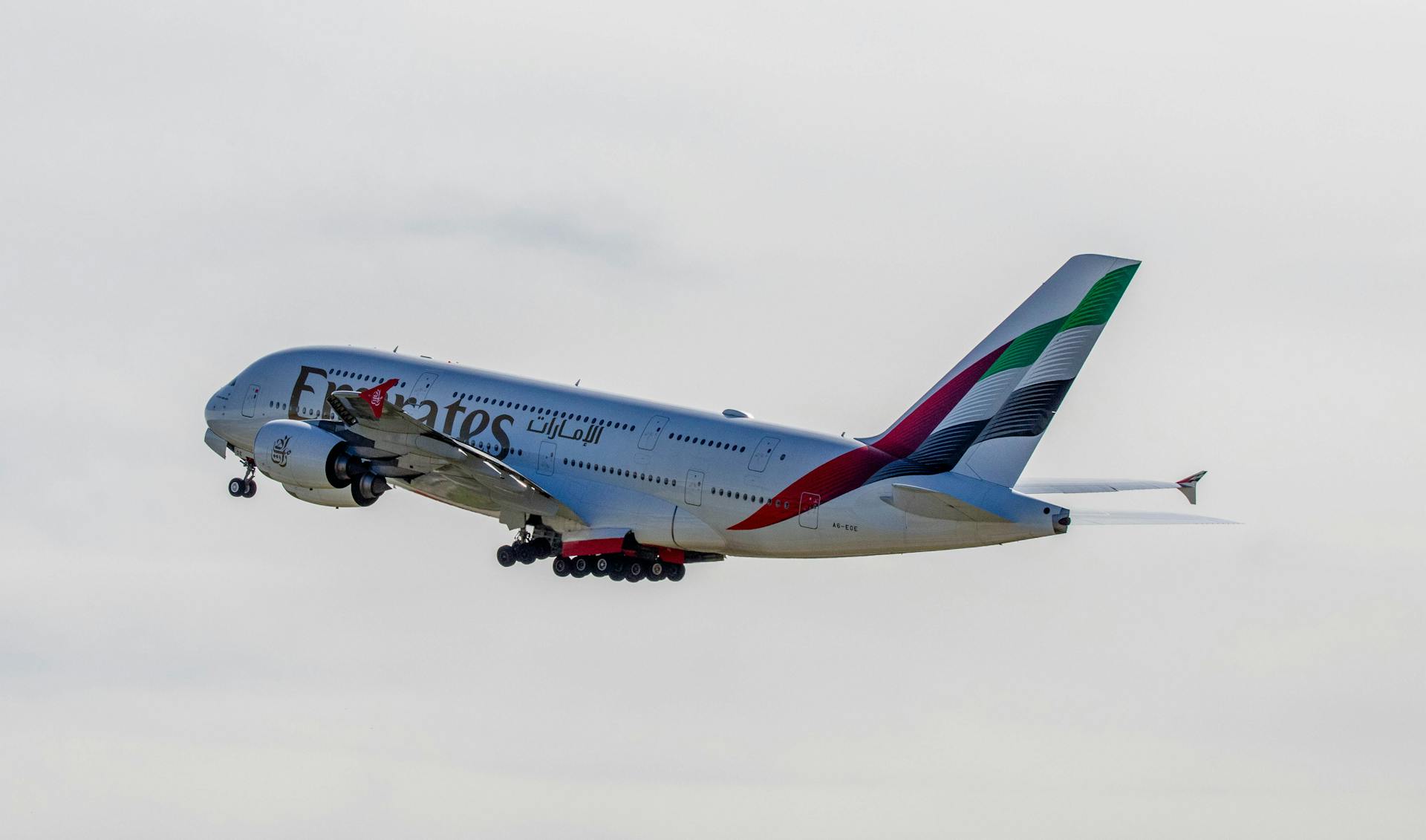 Emirates A380-800 aircraft takes off from Zurich airport, captured in flight.