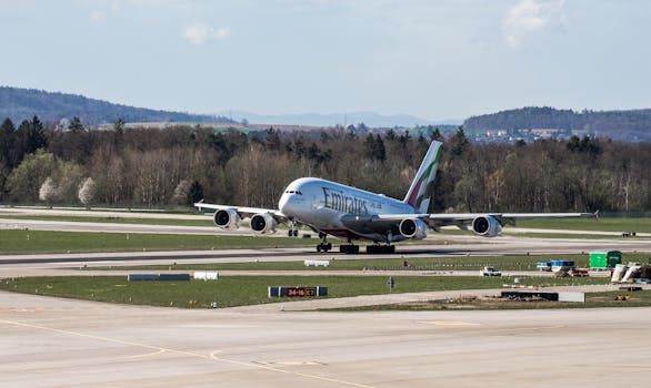 Emirates A380-800 taking off from Zurich Airport runway, in a spring setting.