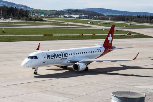 Free A Helvetic Airways aircraft on the runway at Zurich Airport during daylight. Stock Photo