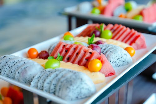 A buffet of fruit and watermelon slices on a plate