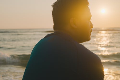 Pensive Man by Sea at Dawn