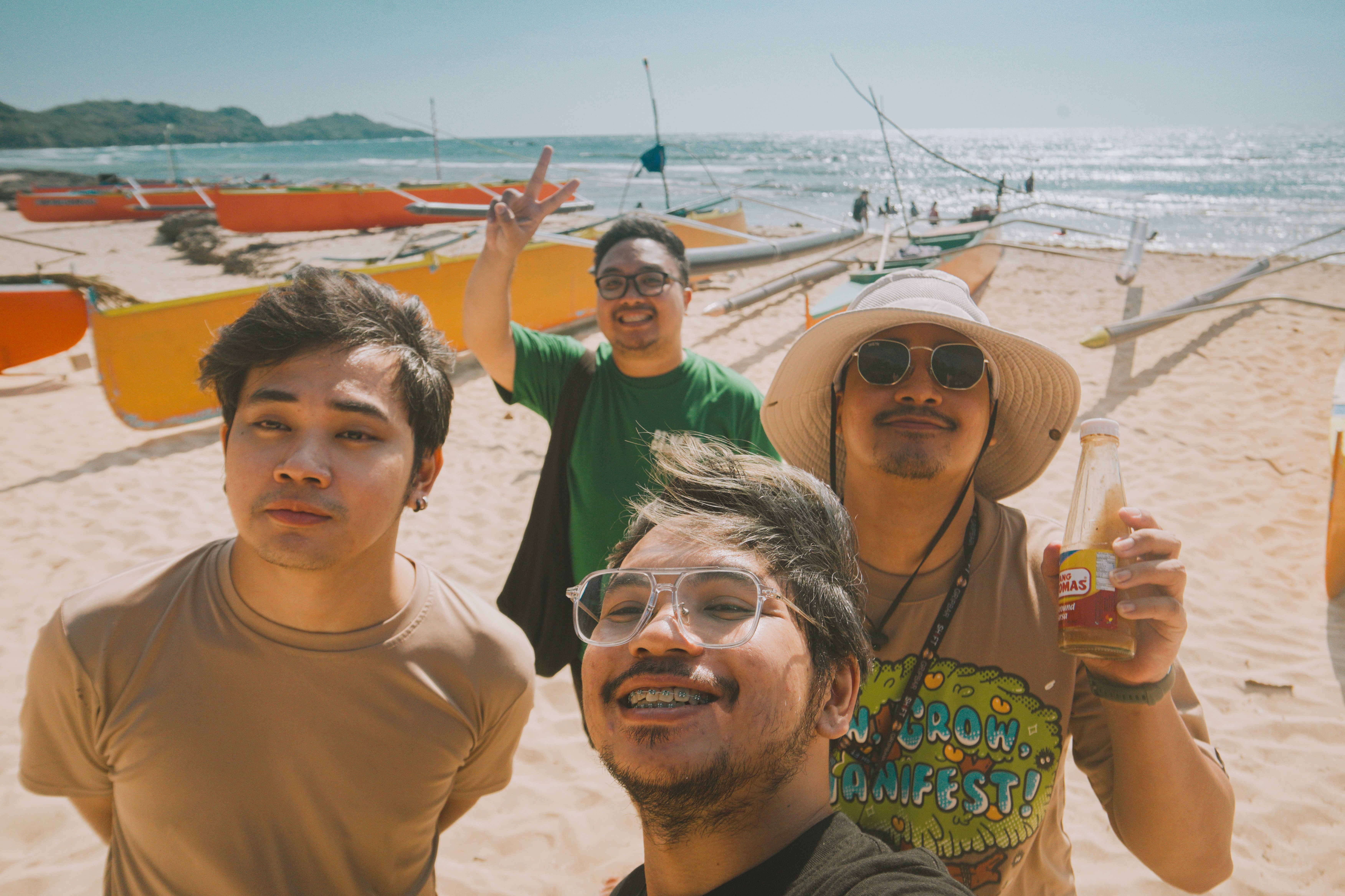 Group of friends on a sunny beach day in Bolinao, Rehiyong Ilocos, enjoying leisure time.
