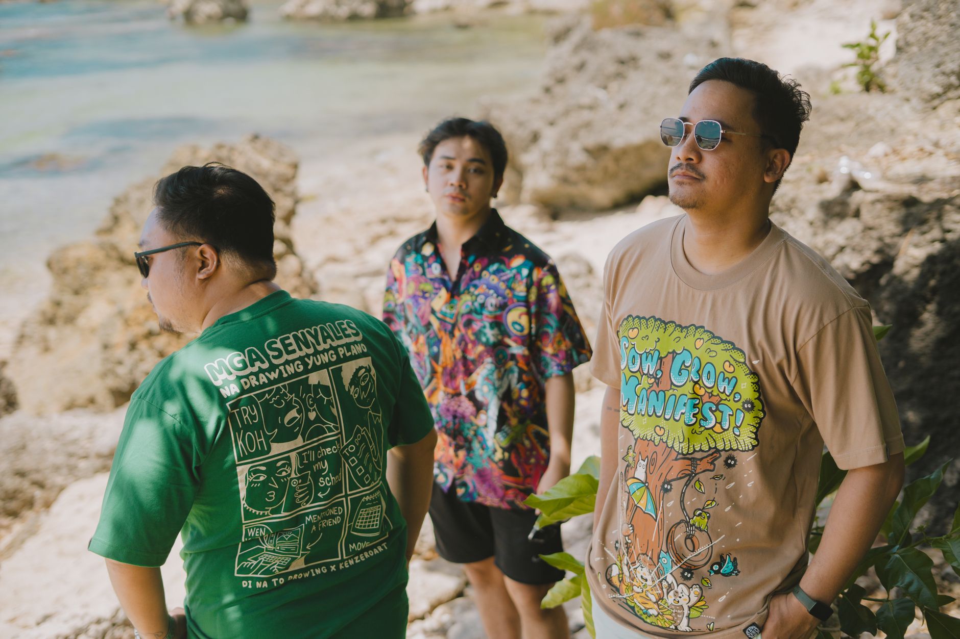 Three adults enjoying a sunny day by the seaside in Bolinao, Philippines.