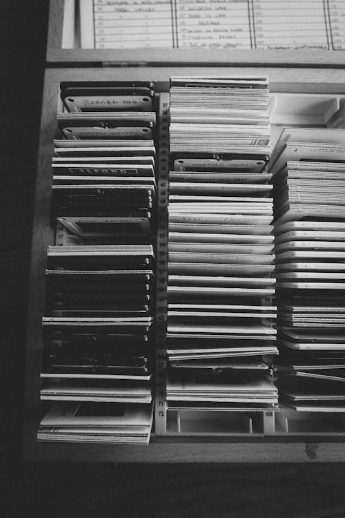 A black and white photo of a bookcase