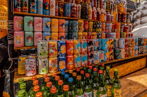 Free Vibrant display of Korean drinks and sodas at a bustling market in Mexico City. Stock Photo