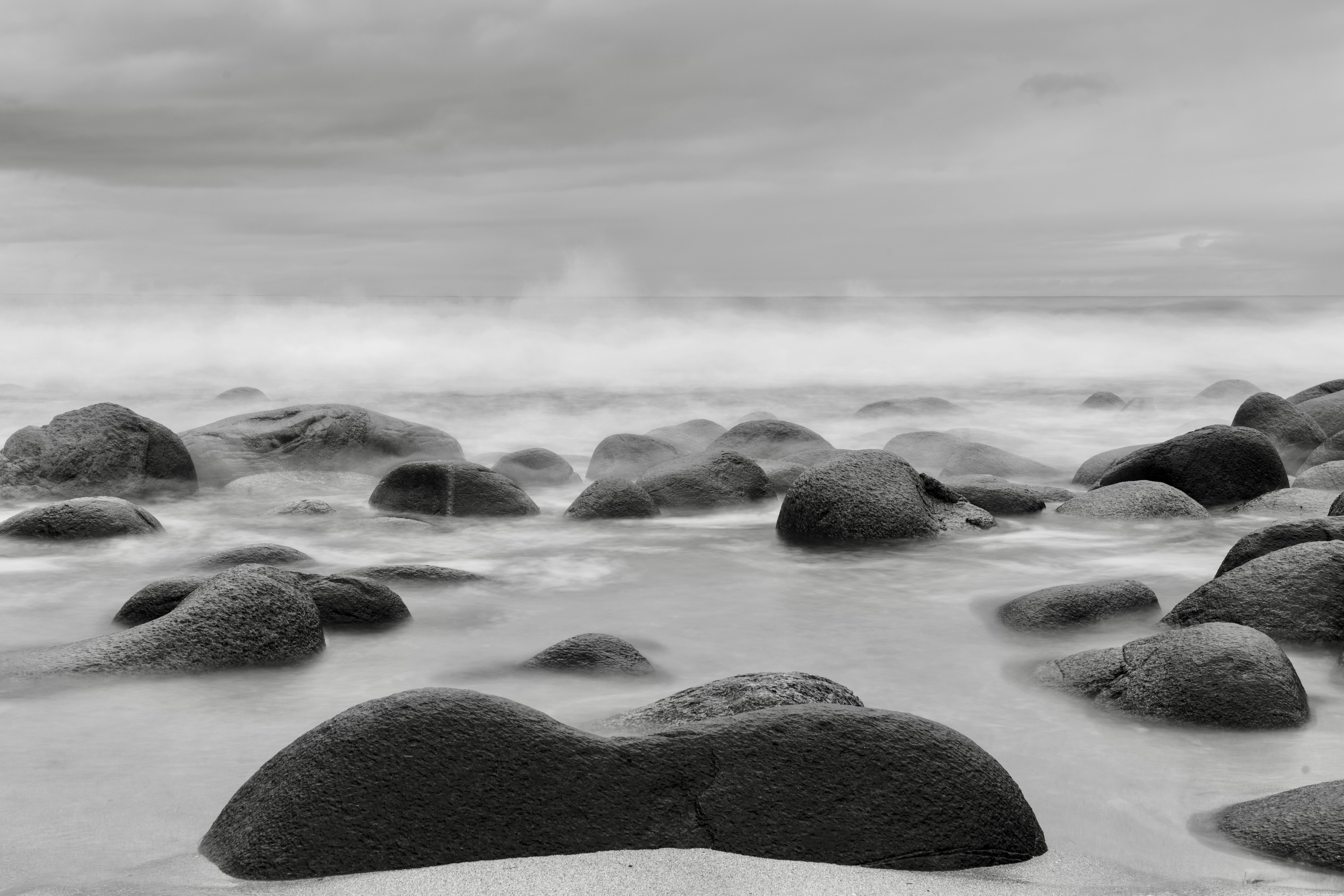 Wave over Rocks on Sea Shore in Black and White · Free Stock Photo