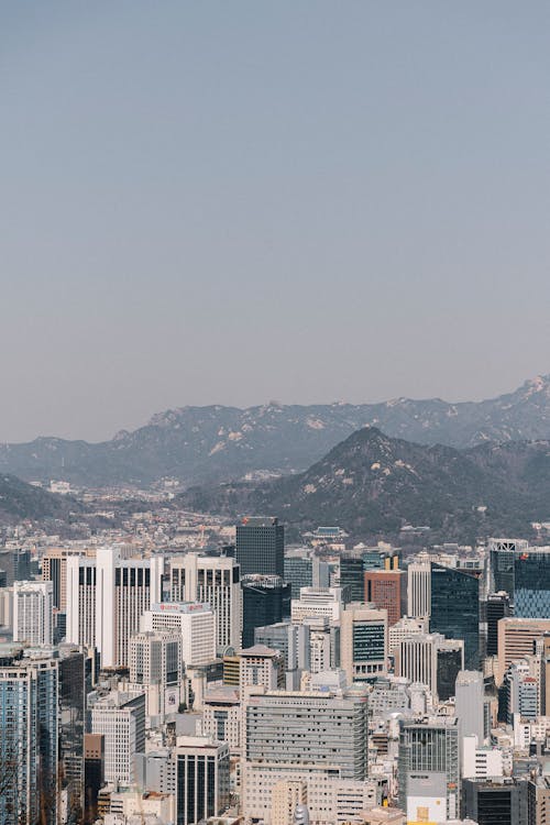 A cityscape with mountains in the background