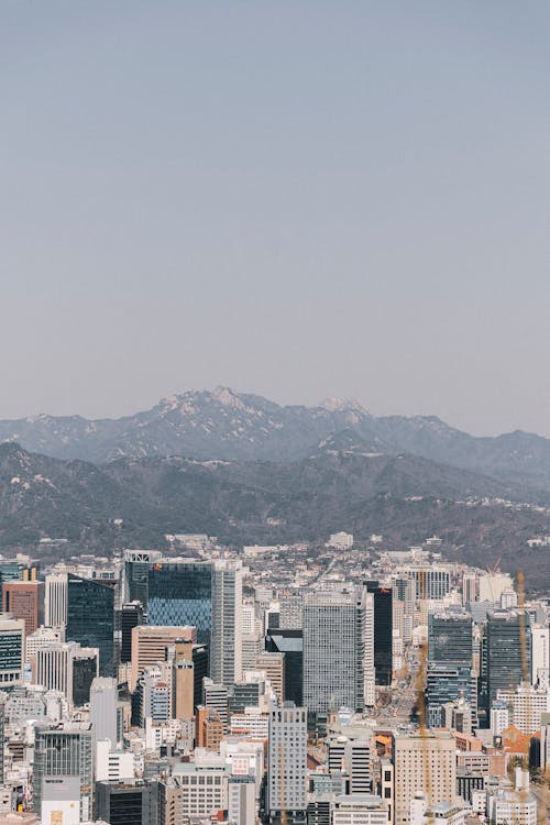 A cityscape with mountains in the background