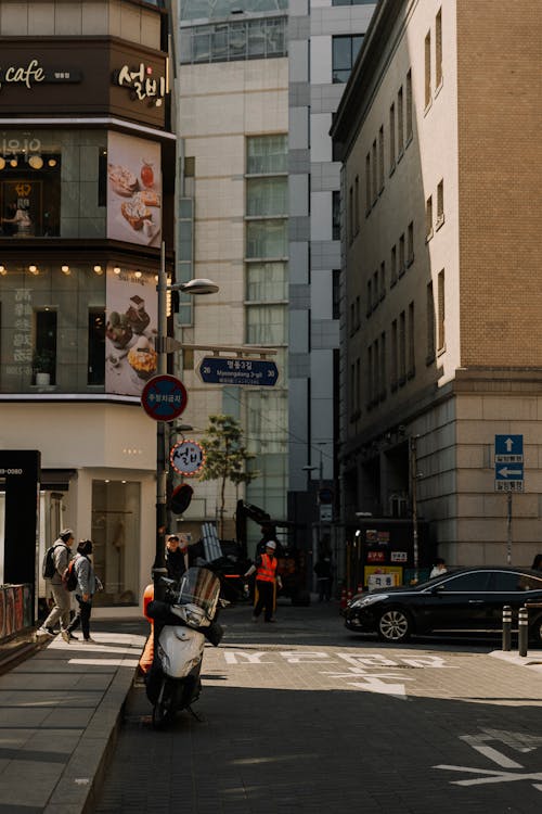 A street with a man riding a motorcycle